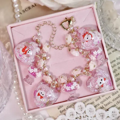 ข้อมือหัวใจแก้วชมพูแมวขาว